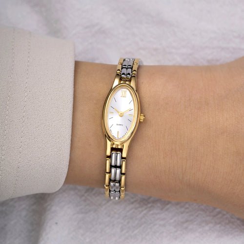 Orologio donna oro 18k e argento bicolore indossato al polso in stile vintage – Elarie Milano